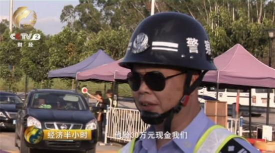 无牌宝马车内藏毒20斤 司机给警察30万求放过
