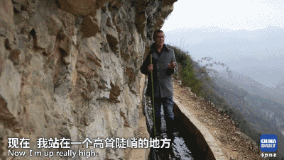 解码中国丨这位当代“愚公”在悬崖峭壁上凿出7千米水渠，现实比神话传说更震撼！
